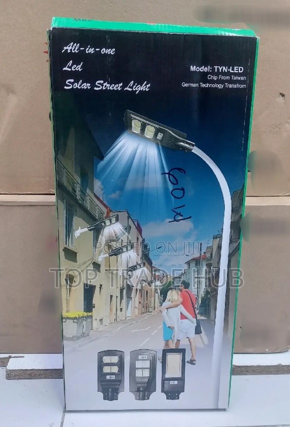 All-in-one 60W solar street light with motion and dusk sensor on a pole